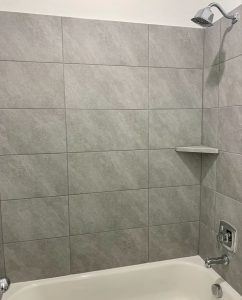 Shower installed with tiles in straight lay pattern